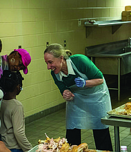 A Thanksgiving of service-The Giving Heart marked its 20th annual Thanksgiving Day Feast last Thursday at the Greater Richmond Convention Center, drawing more than 1,000 people to the exhibit hall for a day centered on meals and community connection. Gov-elect Abigail Spanberger and her family help prepare meals. (Photo courtesy of Abigail Spanberger)
