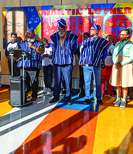 Lighting the way for healing and change-In Richmond, the Drums No Guns Foundation recently celebrated a $96,638 Health Equity Fund grant from the Richmond and Henrico Public Health Foundation to support youth mental and behavioral health in schools affected by community violence. The year-long project, led by Ram Bhagat and coordinated by Kiran Bhagat, brings restorative justice practices to Martin Luther King Jr. Middle School, in collaboration with community-based educators, artists and public health partners. Olufemi Shepsu, a school social worker, speaks at a news conference, joined by social workers, teachers, counselors, and student support specialists involved in implementing the Drums No Guns program. (Photo by Julianne Tripp Hillian/Richmond Free Press)