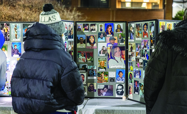 Lighting the way for healing and change-Henrico County’s held its annual Candlelight & Ribbon Tying Ceremony on Tuesday to honor homicide victims. Sponsored by the Henrico County Commonwealth’s Attorney’s Victim/Witness Program, the event featured prayer, remarks from friends and family of the deceased, a memorial board of photographs and a memorial tree where participants placed the names of those they have lost. Early reports show the county has recorded just two homicides through December 2025, down from 22 during the same period last year — a potential 91% decrease if the trend holds through year’s end. Attendees pause at the memorial board displaying photos of loved ones. (Photo by Julianne Tripp Hillian/Richmond Free Press)