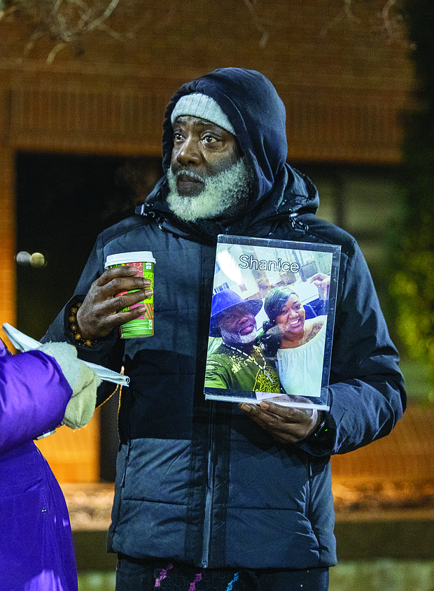 Lighting the way for healing and change-Henrico County’s held its annual Candlelight & Ribbon Tying Ceremony on Tuesday to honor homicide victims. Sponsored by the Henrico County Commonwealth’s Attorney’s Victim/Witness Program, the event featured prayer, remarks from friends and family of the deceased, a memorial board of photographs and a memorial tree where participants placed the names of those they have lost. Early reports show the county has recorded just two homicides through December 2025, down from 22 during the same period last year — a potential 91% decrease if the trend holds through year’s end. Shakim “Shaka” Woodberry holds a framed photo of him and his daughter at the ceremony Dec. 2 outside the government center. She was killed in 2019. Woodberry has since helped found Fathers Advocating Community Teamwork Solutions, a group working to turn “pain into progress.” (Photo by Julianne Tripp Hillian/Richmond Free Press)