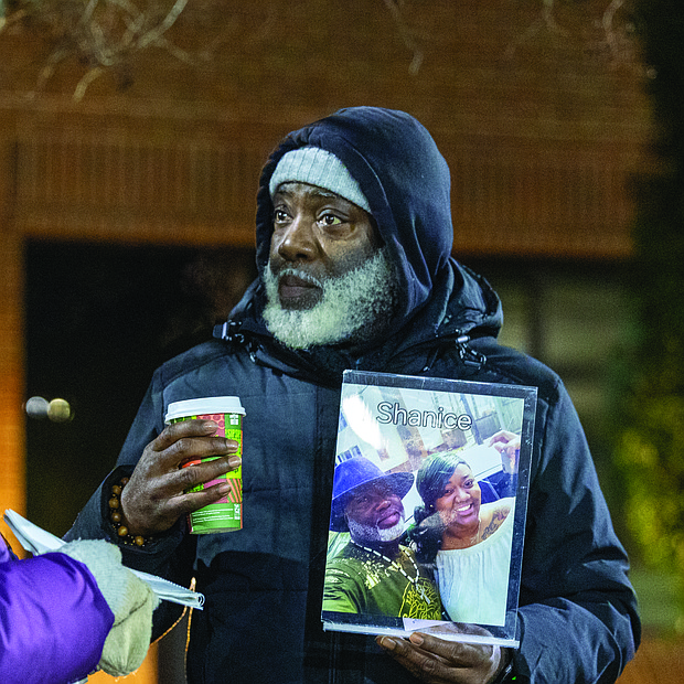 Lighting the way for healing and change-Henrico County’s held its annual Candlelight & Ribbon Tying Ceremony on Tuesday to honor homicide victims. Sponsored by the Henrico County Commonwealth’s Attorney’s Victim/Witness Program, the event featured prayer, remarks from friends and family of the deceased, a memorial board of photographs and a memorial tree where participants placed the names of those they have lost. Early reports show the county has recorded just two homicides through December 2025, down from 22 during the same period last year — a potential 91% decrease if the trend holds through year’s end. Shakim “Shaka” Woodberry holds a framed photo of him and his daughter at the ceremony Dec. 2 outside the government center. She was killed in 2019. Woodberry has since helped found Fathers Advocating Community Teamwork Solutions, a group working to turn “pain into progress.” (Photo by Julianne Tripp Hillian/Richmond Free Press)