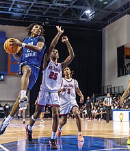 Ahmad Britt #23 of John Marshall High School drives to the basket during the “Battle of Richmond” at the VSU Multipurpose Center on Saturday, Dec. 6. John Marshall defeated Richmond School for the Arts 78-51.