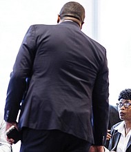 Richmond Chief Administrative Officer Odie Donald chats with Mayor Danny Avula and Council President Cynthia Newbille before their joint session on the budget on Dec. 4.