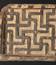 A polychrome terracotta relief with a geometric motif, ca. 550 B.C., by an unknown Phrygian artist. The 9 x 9 1/4-by- 3-1/4 inch fragment is part of the group of 41 terracotta reliefs the VMFA returned to Turkey.