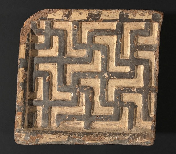 A polychrome terracotta relief with a geometric motif, ca. 550 B.C., by an unknown Phrygian artist. The 9 x 9 1/4-by- 3-1/4 inch fragment is part of the group of 41 terracotta reliefs the VMFA returned to Turkey.