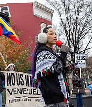Alyssa Gonzalez speaks Saturday, Dec. 6 during a rally at Maggie Walker Memorial Plaza organized by the Richmond branch of the Party for Socialism and Liberation. The rally was part of a nationwide day of action regarding U.S. policy toward Venezuela.