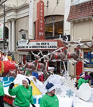Christmas on Broad Street-The 42nd annual Dominion Energy Christmas Parade returned to Broad Street in Richmond on Saturday, Dec. 6. The parade began at 10 a.m. at the Science Museum of Virginia and continued east to Seventh Street. The Atlantic Union Bank float closed out the parade with Santa, joined by Mayla Lemu, a junior at Douglas S. Freeman High School and the Science Museum’s 2025 snow ambassador. (photo by Julianne Tripp Hillian/Richmond Free Press)