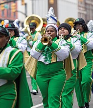 Christmas on Broad Street-The 42nd annual Dominion Energy Christmas Parade returned to Broad Street in Richmond on Saturday, Dec. 6. The parade began at 10 a.m. at the Science Museum of Virginia and continued east to Seventh Street. The Richmond Public Schools All City Marching Band brings a burst of sound down Broad Street as students perform in the parade. (photo by Julianne Tripp Hillian/Richmond Free Press)