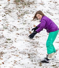 First snow, first fun-Mathilde Miller, 10, snowboards at Forest Hill Park.(photo by Julianne Tripp Hillian/Richmond Free Press)