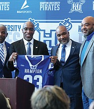 Hampton University President Darrell K. Williams, left, introduces Van Malone as the Pirates’ 23rd head football coach during a news conference Friday. Also pictured are athletic director Anthony D. Henderson Sr. and Board of Trustees member Calvin Butts.  Photo by