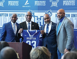 Hampton University President Darrell K. Williams, left, introduces Van Malone as the Pirates’ 23rd head football coach during a news conference Friday. Also pictured are athletic director Anthony D. Henderson Sr. and Board of Trustees member Calvin Butts.  Photo by