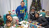 Jesus Ibanez, general manager for Lego Manufacturing Virginia, poses with attendees at a Build to Give event at the Children’s Museum of Richmond in Chesterfield County on Friday.