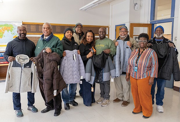 Community efforts bring warmth to students-Community groups and organizations stepped in last week to help Richmond students stay warm as colder weather sets in, with two separate coat distribution effort reaching hundreds of children.  Across the city, members of Club 533 organized a separate coat drive to support students at Carver Elementary School. The historic Jackson Ward-based group collected
more than 100 coats, with an additional 20 donated by
Brothers and Sisters Combined Professional Firefighters Inc.
The coats were delivered Dec. 12 and will be distributed
to students Friday. Carlin Gibson Sr. (from left); James Henson; Chuck Bradby; Robert Lester; Carver Elementary School Principal Teresa Anderson; Kofi K. Holder; Jerry Gunter; Lynette Wilkins, Community In Schools support for Carver Elementary; and Mark Williams at the coat drive. (photo by Julianne Tripp Hillian/Richmond Free Press)