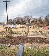 Cityscape Slices of life and scenes in Richmond-The city, in partnership with the Public Art Commission and Gilpin Community Farm, unveiled the installation, which features carved relief botanical and historical motifs honoring visionary Gilpin residents Charles S. Gilpin and Lillie Estes, as well as local flora and fauna. The gateway and accompanying seating serve as a visual landmark celebrating creativity and community collaboration. (photo by Sandra Sellars/Richmond Free Press)