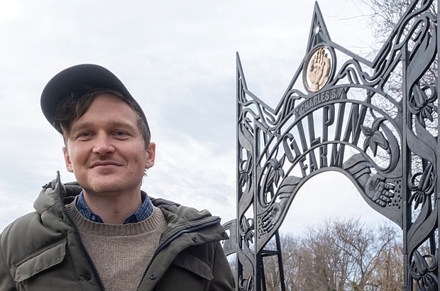 Cityscape Slices of life and scenes in Richmond-Richmond artist Barry O’Keefe stands beside his cast-iron gateway arch at Gilpin Community Farm. The city, in partnership with the Public Art Commission and Gilpin
Community Farm, unveiled the installation, which features carved relief botanical and historical motifs honoring visionary Gilpin residents Charles S. Gilpin and Lillie Estes, as well as local flora and fauna. (photo by Sandra Sellars/Richmond Free Press)