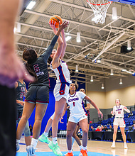 University of Richmond guard Rachel Ullstrom attacks the basket during the
Spiders’ 72-58 win over Alabama A&M on Saturday in the 4 Tha Culture Holiday Hoops Classic. Ullstrom finished with a game-high 20 points.