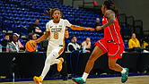 VCU’s Daija Preston, a freshman guard from Douglasville, Ga., drives the ball past a Georgia defender on Friday during the 4 Tha Culture Holiday Hoops Classic at the Henrico Sports & Events Center. Georgia won 72-53. VCU lost to Penn State 78-66 on Saturday.