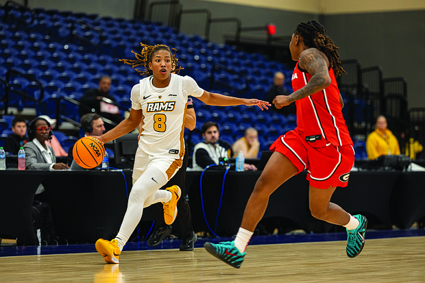 VCU’s Daija Preston, a freshman guard from Douglasville, Ga., drives the ball past a Georgia defender on Friday during the 4 Tha Culture Holiday Hoops Classic at the Henrico Sports & Events Center. Georgia won 72-53. VCU lost to Penn State 78-66 on Saturday.