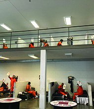 Inmates at a correctional facility receive Christmas Hope Packs from Good News Global, a Richmond-based ministry. The packs include devotional materials, food items and hygiene supplies as part of an initiative expected to reach 170 facilities across 20 states and 20 countries.