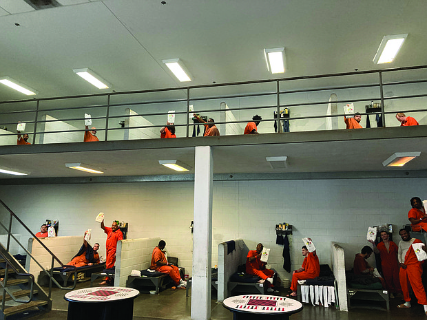 Inmates at a correctional facility receive Christmas Hope Packs from Good News Global, a Richmond-based ministry. The packs include devotional materials, food items and hygiene supplies as part of an initiative expected to reach 170 facilities across 20 states and 20 countries.