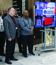 City officials gather at a news conference on Operation Vaporize at City Hall on Friday.