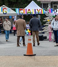 Carytown market blends local shopping with community support-Shoppers explored the Carytown Queer Cheer Holiday Market organized by TransJam on Sunday, Dec. 21. The event offered local gifts while supporting queer and trans community members in need. Attendees also contributed to the Big GAY Give, which funds microgrants for queer and trans individuals. TransJam hosts similar markets year-round, including its monthly Big Gay Market RVA, with the next flea market–style event scheduled for Jan. 11. Shoppers browse the market in Carytown. (photo by Julianne Tripp Hillian/Richmond Free Press)