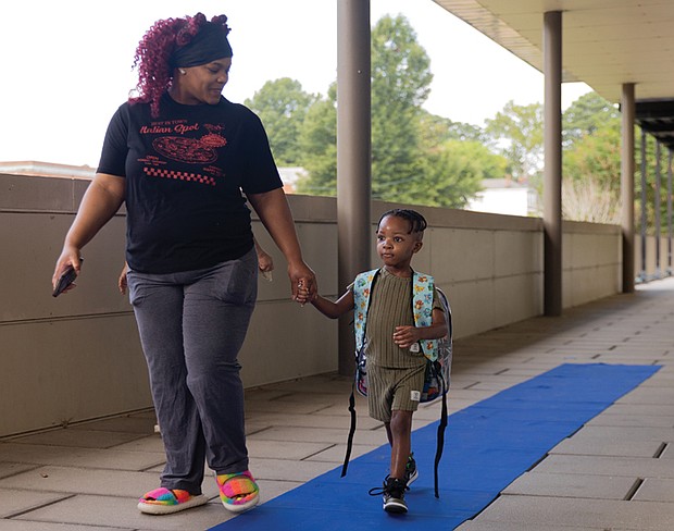 A Year in Focus-From marches to milestones, Richmond’s people and events shaped the year. Demonstrations, school celebrations, cultural festivals and sports brought the community together across the city. These images capture the moments that marked 2025 in Richmond. Legend Agamah and his mother head into his first day of pre-K at Oak Grove-Bellemeade Elementary
School on July 21. Oak Grove-Bellemeade is one of four Richmond Public Schools operating on a 200-day calendar.(photo by Julianne Tripp Hillian/Richmond Free Press)