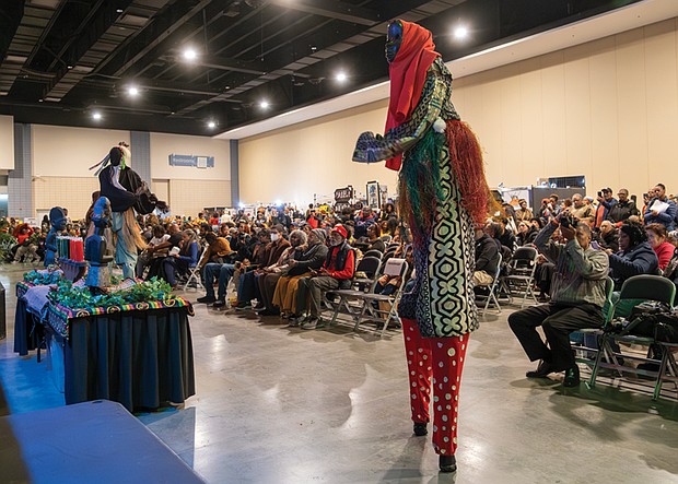 Kwanzaa festival elevates African heritage-Stilt walkers pay tribute to ancestors during the annual Capital City Kwanzaa Festival at the Richmond
Convention Center on Saturday, Dec. 27. Virginia’s largest Kwanzaa celebration brings together vibrant performances, hands-on workshops, children’s activities. The African Market and authentic cuisine—all honoring the holiday’s seven principles of unity, self-determination,
collective work, cooperative economics, purpose, creativity and faith. (photo by Sandra Sellars/Richmond Free Press)