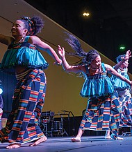 Honoring heritage with community and celebration-Members of the Elegba Folklore Society perform a traditional dance at the annual Capital City Kwanzaa Festival at the Greater Richmond Convention Center in downtown Richmond on Saturday, Dec. 27. (photo by Sandra Sellars/Richmond Free Press)