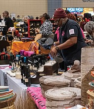Honoring heritage with community and celebration-A crowded Ujamaa Market offered cultural merchandise throughout the day during the festival, which featured performances, workshops, children’s activities and African and Pan-African cuisine. (photo by Sandra Sellars/Richmond Free Press)