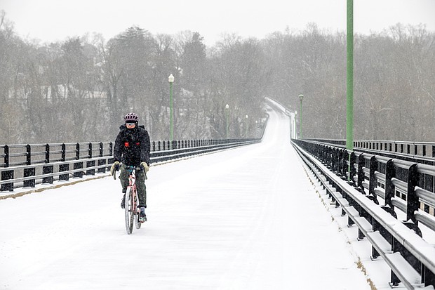 A Year in Focus-From marches to milestones, Richmond’s people and events shaped the year. Demonstrations, school celebrations, cultural festivals and sports brought the community together across the city. These images capture the moments that marked 2025 in Richmond. A biker rides across the snow-covered Nickel Bridge on Feb. 19 as pedestrians and cyclists take advantage of the span’s closure during wintry weather. (photo by Julianne Tripp Hillian/Richmond Free Press)