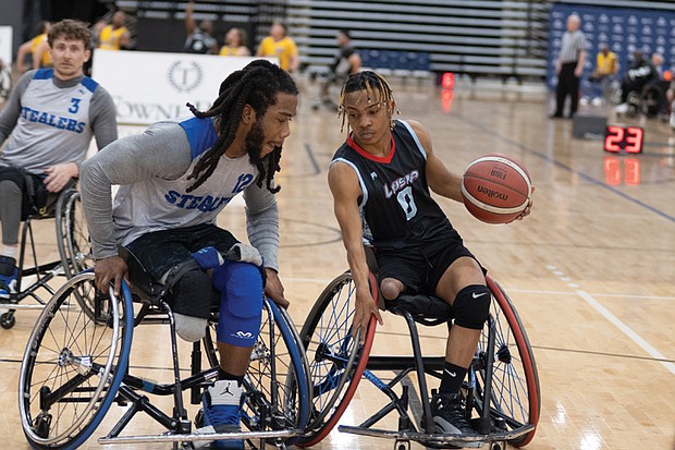 A Year in Focus-From marches to milestones, Richmond’s people and events shaped the year. Demonstrations, school celebrations, cultural festivals and sports brought the community together across the city. These images capture the moments that marked 2025 in Richmond. Khalil Harriot of the Shepherd Stealers defends Cameron Davis of the LWSRA Hawks during a Division II game at the National Wheelchair Basketball Adult Championships
on April 11 at the Henrico Sports & Events Center. (photo by Sandra Sellars/Richmond Free Press)