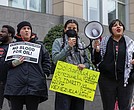 LJ Delao, center, speaks during a protest outside the federal courthouse in Downtown Richmond on Jan. 3. Demonstrators opposed the U.S. military action in Venezuela and called for the release of Venezuelan President
Nicolás Maduro and his wife, Cilia Flores.