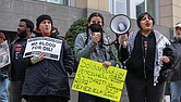 LJ Delao, center, speaks during a protest outside the federal courthouse in Downtown Richmond on Jan. 3. Demonstrators opposed the U.S. military action in Venezuela and called for the release of Venezuelan President
Nicolás Maduro and his wife, Cilia Flores.