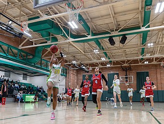 Martin drives to the basket during Tuesday’s game. The Dragons won, 59-17.