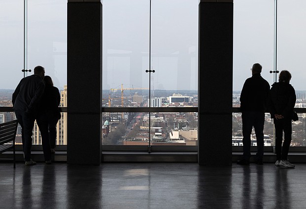 Cityscape Slices of life and scenes in Richmond-Visitors take in sweeping views from Richmond’s newly reopened City Hall Observation Deck
on Friday. The 18th-floor overlook, shuttered since the start of the pandemic in 2020, officially welcomed back the public following Mayor Danny Avula’s announcement Thursday. The deck is now open 10 a.m. to 3 p.m. Monday through Friday, excluding city holidays, weather permitting. (photo by Julianne Tripp Hillian/Richmond Free Press)