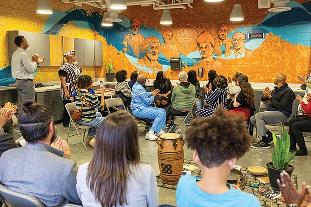 Mural at MLK Middle highlights restorative justice-The restorative justice team at Martin Luther King Jr. Middle School unveils the Uhuru (Freedom) mural on Jan. 7. The mural, designed by Alfonso Perez and Khalid Thompson, features historical and cultural figures intended to reflect themes of ancestral intelligence and educational excellence. The unveiling also honored the life and work of Solomon W. Jefferson, a leader in restorative justice efforts in Richmond Public Schools. Jefferson died in November. (photo by Julianne Tripp Hillian/Richmond Free Press)