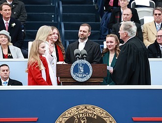 Virginia Gov. Abigail Spanberger is sworn in Jan. 17, becoming the first woman to hold the state’s highest office, with her husband and daughters by her side. Julianne Tripp Hillian/Richmond Free Press