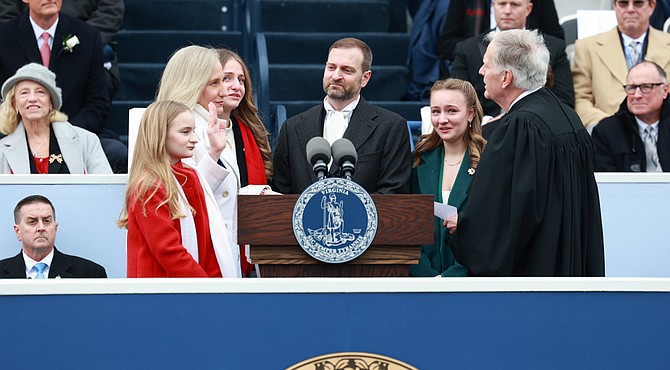 Virginia Gov. Abigail Spanberger is sworn in Jan. 17, becoming the first woman to hold the state’s highest office, with her husband and daughters by her side. Julianne Tripp Hillian/Richmond Free Press