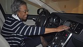 Gladys West adjusts the settings on her car’s navigation system.