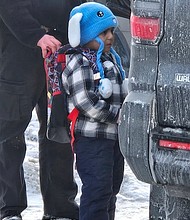 Federal immigration agents walk 5-year-old Liam Conejo Ramos to a vehicle in front of his Minneapolis home on Tuesday./ CNN Newsource