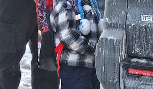 Federal immigration agents walk 5-year-old Liam Conejo Ramos to a vehicle in front of his Minneapolis home on Tuesday./ CNN Newsource