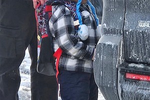 Federal immigration agents walk 5-year-old Liam Conejo Ramos to a vehicle in front of his Minneapolis home on Tuesday./ CNN Newsource