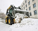 A worker plows a parking lot at the Virginia Housing Development Association, 601 S. Belvidere St., in Richmond during a winter storm in December 2018. Forecasters are now warning the Richmond area to brace for snow.