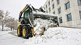 A worker plows a parking lot at the Virginia Housing Development Association, 601 S. Belvidere St., in Richmond during a winter storm in December 2018. Forecasters are now warning the Richmond area to brace for snow.