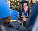 Adam Turck’s photo is held high at the Bell Tower in Capitol Square on Monday, during the 34th annual Virginia Vigil and Advocacy Day to Prevent Gun Violence on Lobby Day. Many attendees remembered Turck, who was fatally shot in Shockoe Bottom in August.