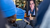Adam Turck’s photo is held high at the Bell Tower in Capitol Square on Monday, during the 34th annual Virginia Vigil and Advocacy Day to Prevent Gun Violence on Lobby Day. Many attendees remembered Turck, who was fatally shot in Shockoe Bottom in August.