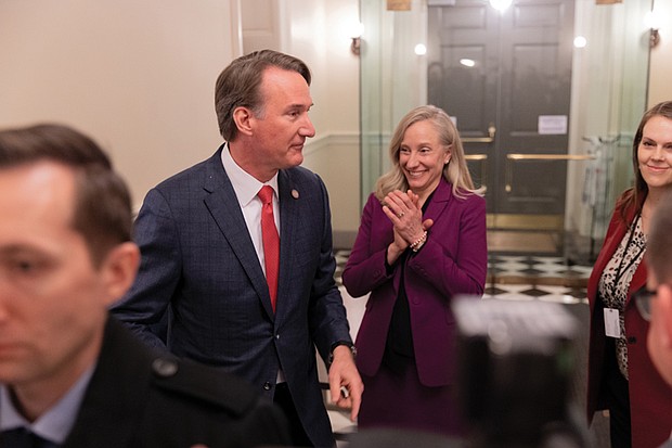 Ladies and gentlemen … start your terms- Virginia turns a page as lawmakers take their oaths and Gov. Abigail Spanberger was inaugurated last week. The first day of the 2026 General Assembly session on Jan. 14 saw delegates and state leaders assume their roles. Former Gov. Glenn Youngkin and Gov. Abigail Spanberger, then governor-elect, speak with members of the media while moving between House meeting rooms at the Capitol in Richmond on Jan. 14, the first day of the General Assembly session. (photo by Julianne Tripp Hillian/Richmond Free Press)