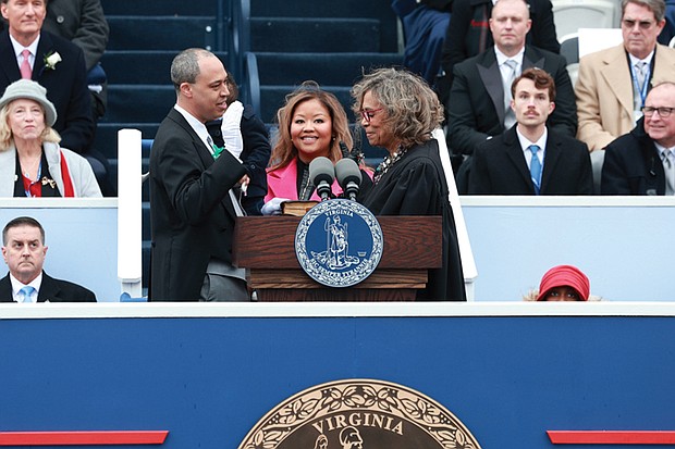 Ladies and gentlemen … start your terms- Virginia turns a page as lawmakers take their oaths and Gov. Abigail Spanberger was inaugurated last week. The first day of the 2026 General Assembly session on Jan. 14 saw delegates and state leaders assume their roles. Days later, Spanberger took the oath of office at the Virginia State Capitol in front of thousands, joined by Attorney General Jay C. Jones and Lt. Gov. Ghazala Hashmi. Lyn M. Simmons, chief judge of the Norfolk Juvenile and Domestic Relations District Court, administers the oath of office to Attorney General-elect Jay C. Jones, joined by his wife Mavis Baah Jones, on Saturday, Jan. 18. Jones becomes the first Black attorney general of
the state.(photo by Julianne Tripp Hillian/Richmond Free Press)