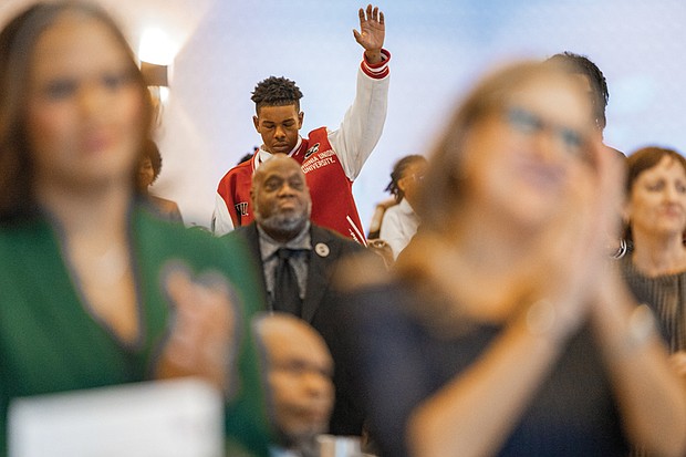 Voices raised for peace and change on MLK Day-Richmonders marked Martin Luther King Jr. Day with a series of events, including Virginia Union University’s 47th annual community leaders breakfast, a candlelight vigil for peace outside the Virginia War Memorial, and Lobby Day rallies for gun violence prevention and gun rights at Capitol Square. VUU freshman E’shun Davis during the keynote address from Jeffery O Smith. (photo by Julianne Tripp Hillian/Richmond Free Press)